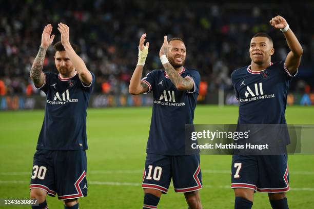 Lionel Messi, Neymar and Kylian Mbappe of Paris Saint-Germain celebrate after victory in the UEFA Champions League group A match between Paris...