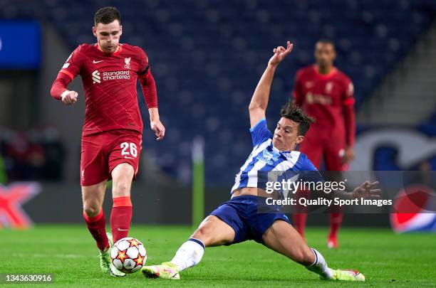 Mateus Uribe of FC Porto competes for the ball with Andrew Robertson of Liverpool FC during the UEFA Champions League group B match between FC Porto...