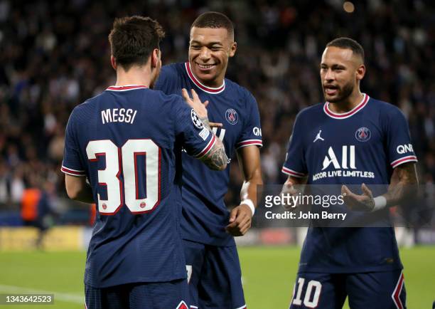 Lionel Messi of PSG celebrates his goal with Kylian Mbappe, Neymar Jr of PSG during the UEFA Champions League group A match between Paris...