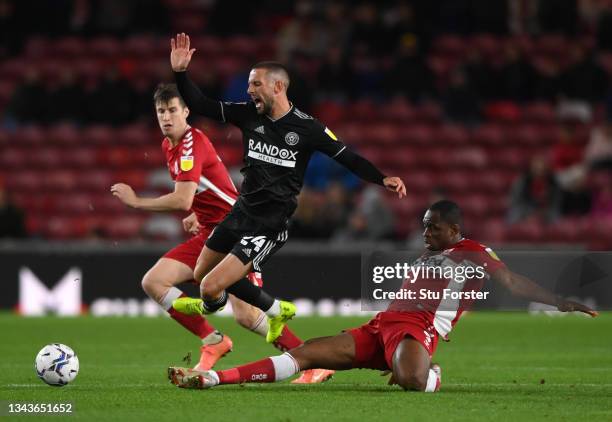 Middlesbrough player Uche Ikpeazu tackles Conor Hourihane during the Sky Bet Championship match between Middlesbrough and Sheffield United at...