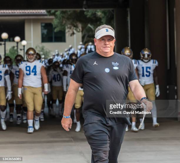 Head coach Chip Kelly of the UCLA Bruins enters the stadium during an NCAA Pac-12 college football game against the Stanford Cardinal on September...