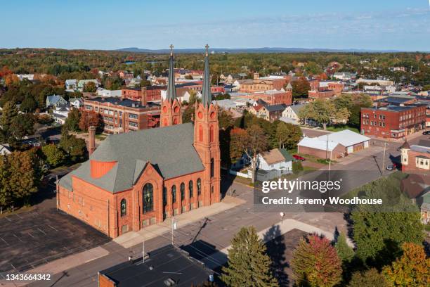 aerial view of the city of calumet with st paul the apostle catholic church in the foreground - wisconsin v michigan stock-fotos und bilder