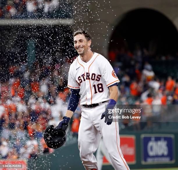 Jason Castro of the Houston Astros walks in the ninth inning as Carlos Correa scores the winning run against the Tampa Bay Rays at Minute Maid Park...