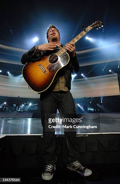 American Idol Season 9 winner Lee DeWyze performs during the 2010 American Idol Live! tour opener at The Palace of Auburn Hills on July 1, 2010 in...