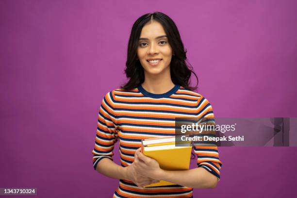 portrait of young women student, stock photo - student coloured background stock pictures, royalty-free photos & images