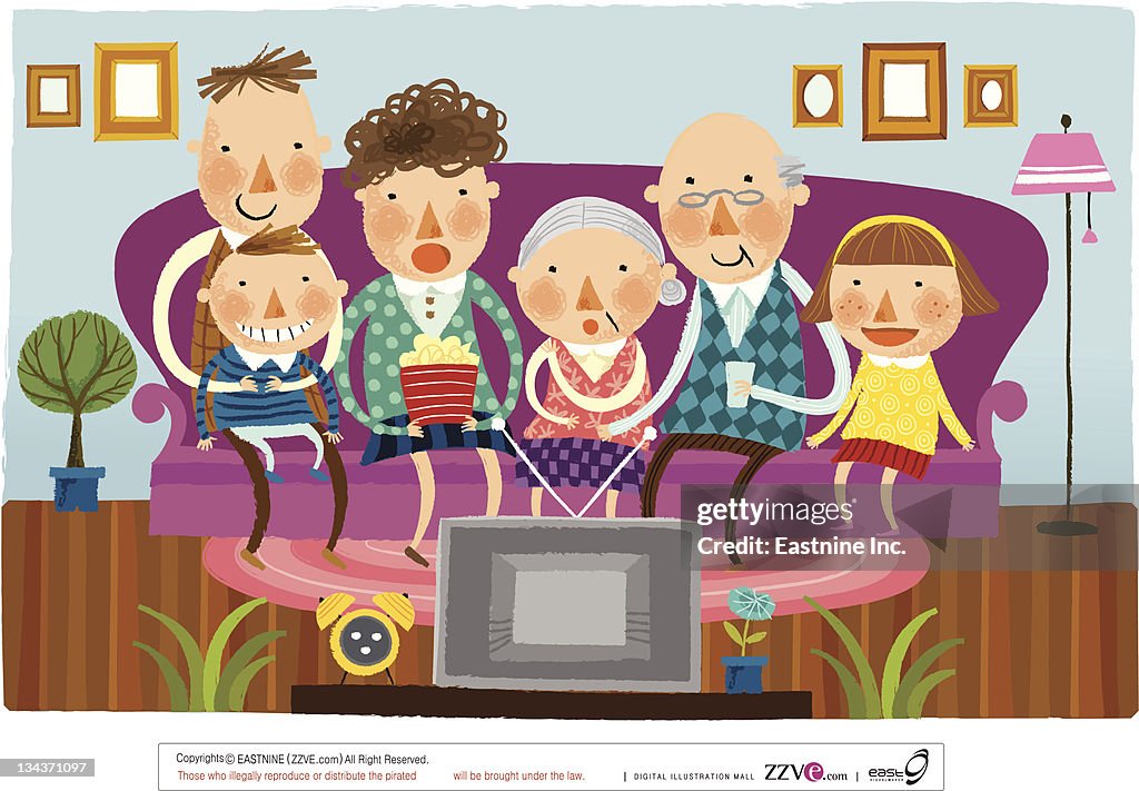 Large family watching television at home