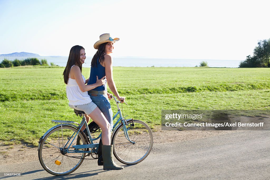 Women playing on bicycle