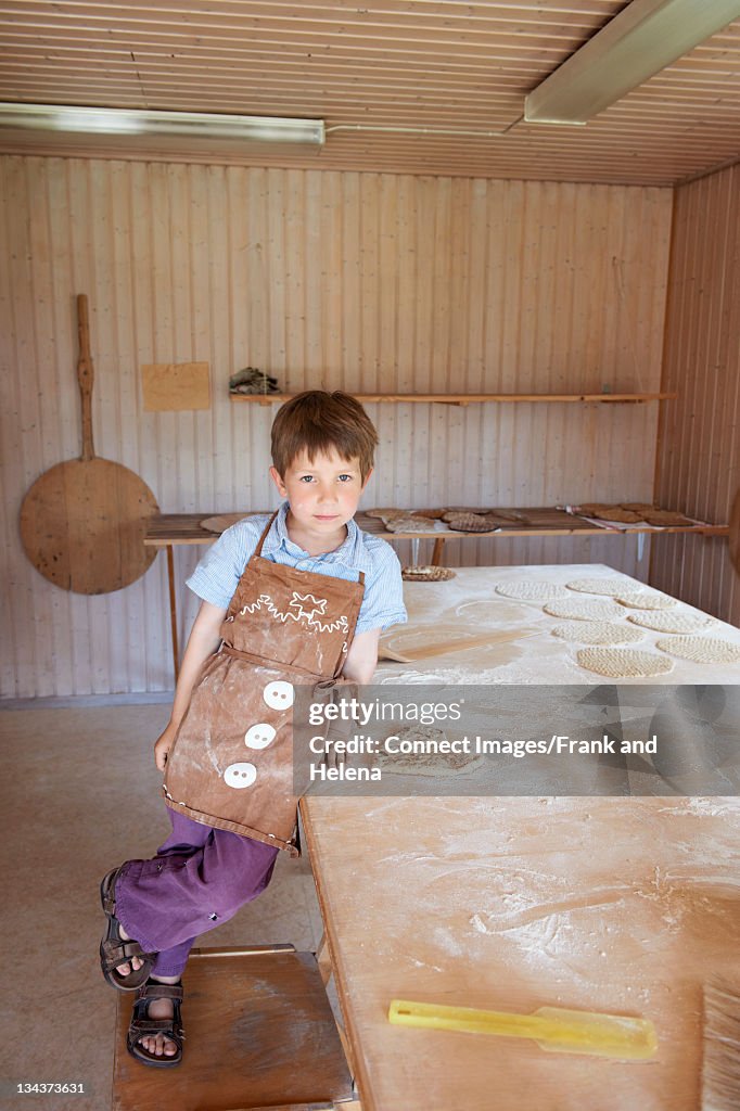 Boy with heart-shaped flatbread