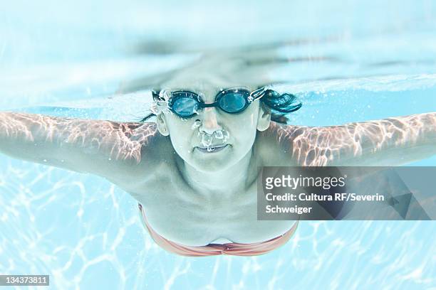 woman in goggles swimming in pool - algarve underwater stock pictures, royalty-free photos & images