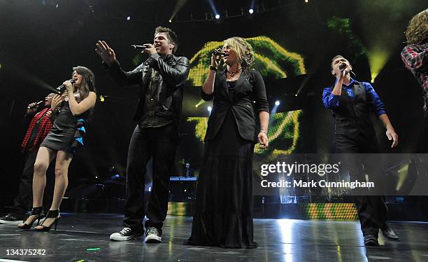 American Idol Season 9 finalist Michael Lynche, Katie Stevens, winner Lee DeWyze, runner-up Crystal Bowersox and finalist Aaron Kelly perform during...