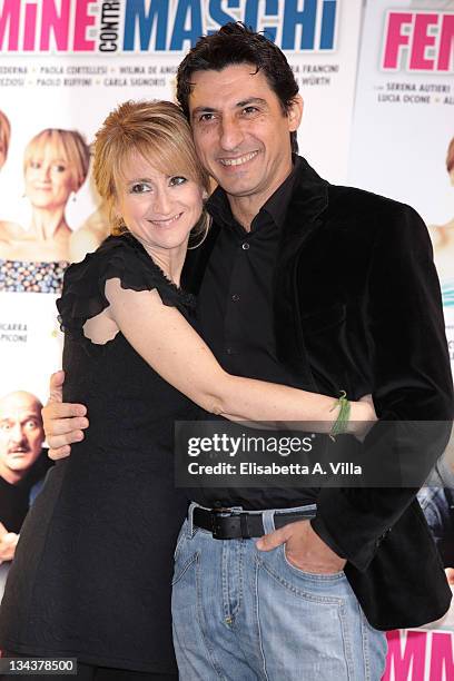 Italian actors Luciana Littizzetto and Emilio Solfrizzi attend "Femmine Contro Maschi" photocall at Adriano Cinema on January 28, 2011 in Rome, Italy.