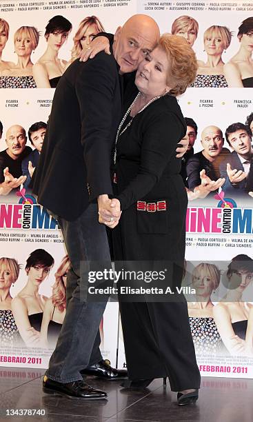 Italian actors Claudio Bisio and Wilma De Angelis attend "Femmine Contro Maschi" photocall at Adriano Cinema on January 28, 2011 in Rome, Italy.