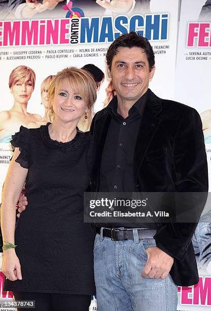 Italian actors Luciana Littizzetto and Emilio Solfrizzi attend "Femmine Contro Maschi" photocall at Adriano Cinema on January 28, 2011 in Rome, Italy.