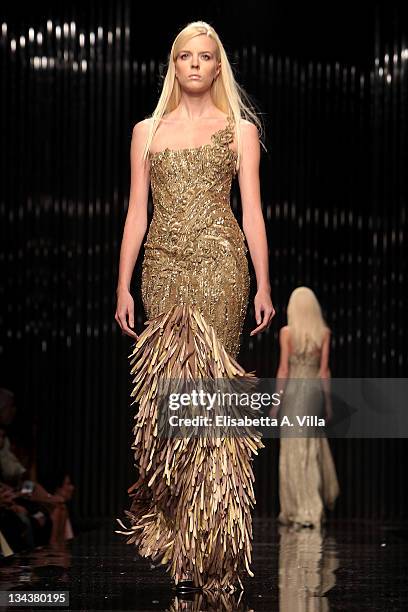 Model walks the runway during Tony Ward fashion show as part of AltaRoma AltaModa Autumn/Winter 2010 on July 12, 2010 in Rome, Italy.