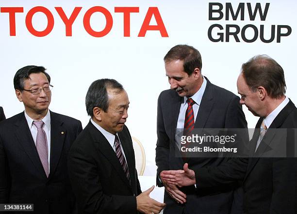 Yasumori Ihara, director and senior managing executive officer of Toyota Motor Corp., left, Klaus Draeger, head of development at Bayerische Motoren...