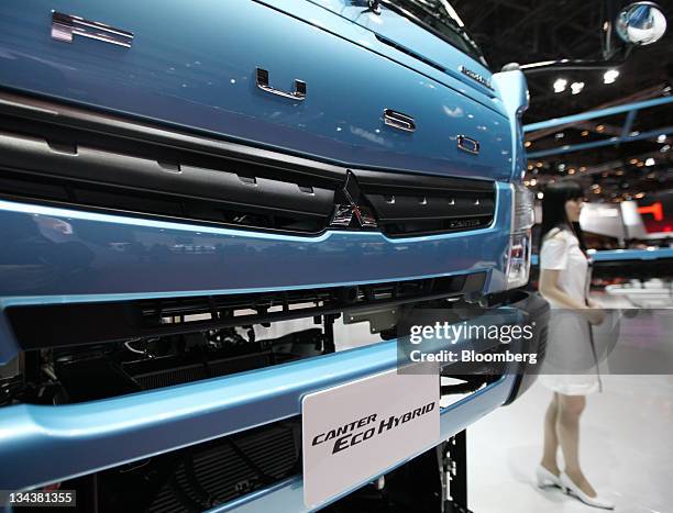 Mitsubishi Fuso Truck & Bus Corp.'s Canter Eco Hybrid truck is displayed at the Tokyo Motor Show 2011 in Tokyo, Japan, on Thursday, Dec. 1, 2011. The...