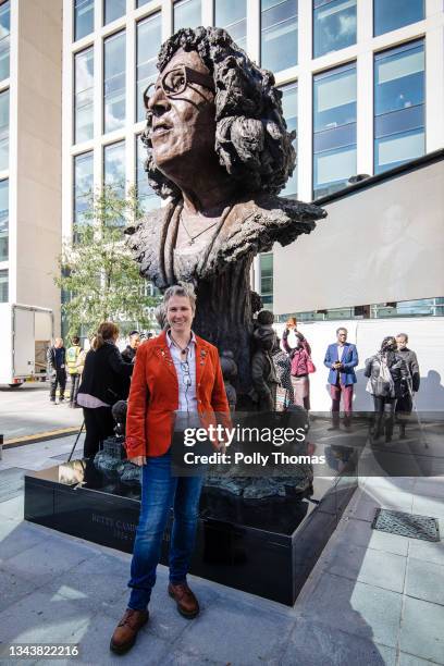 Sculptor Eve Sherpherd poses for a photo by the newly unveiled statue of Betty Campbell MBE on September 29, 2021 in Cardiff, Wales. Betty Campbell...