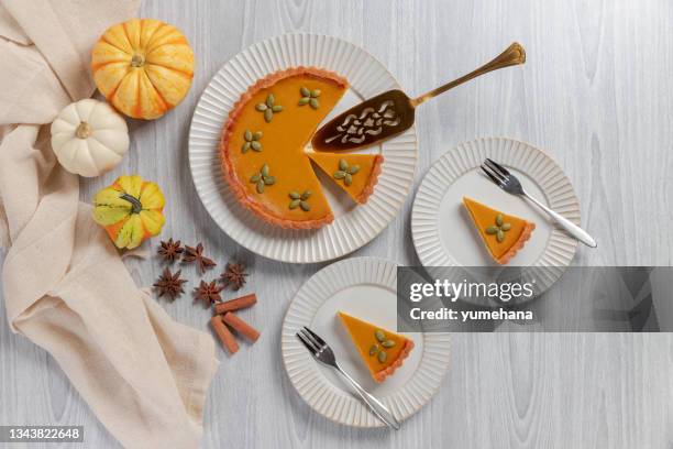 tasty pumpkin pie, tart made for thanksgiving day. top view - cake top view stock pictures, royalty-free photos & images