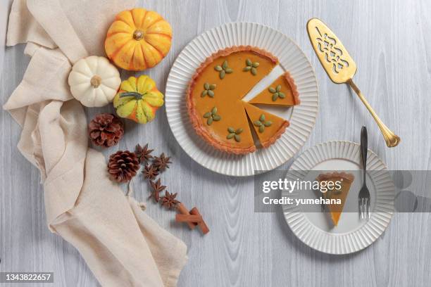 tasty pumpkin pie, tart made for thanksgiving day. top view - cake top view stock pictures, royalty-free photos & images