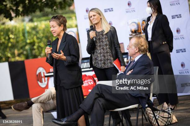 Polly Moore and President Paolo Scaroni attend the AC Milan at 'Restore The Music: Milan' event at Sant’Ambrogio Institute on September 29, 2021 in...