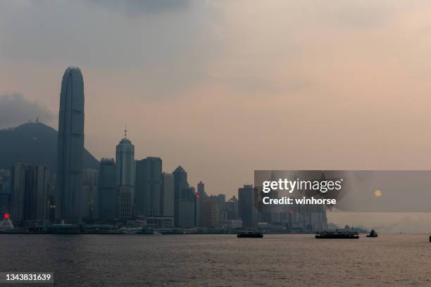 air pollution on victoria harbour in hong kong - ferry pollution stockfoto's en -beelden