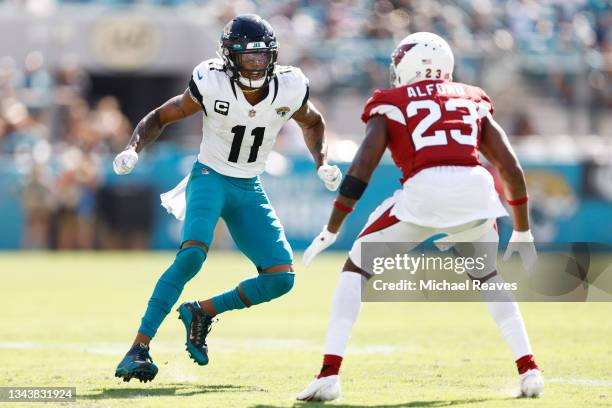 Marvin Jones of the Jacksonville Jaguars in action against Robert Alford of the Arizona Cardinals at TIAA Bank Field on September 26, 2021 in...