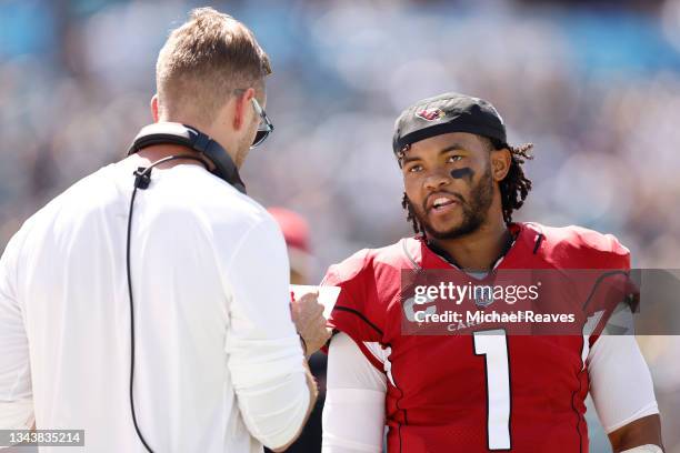 Kyler Murray of the Arizona Cardinals talks with head coach Kliff Kingsbury against the Jacksonville Jaguars during the first half at TIAA Bank Field...