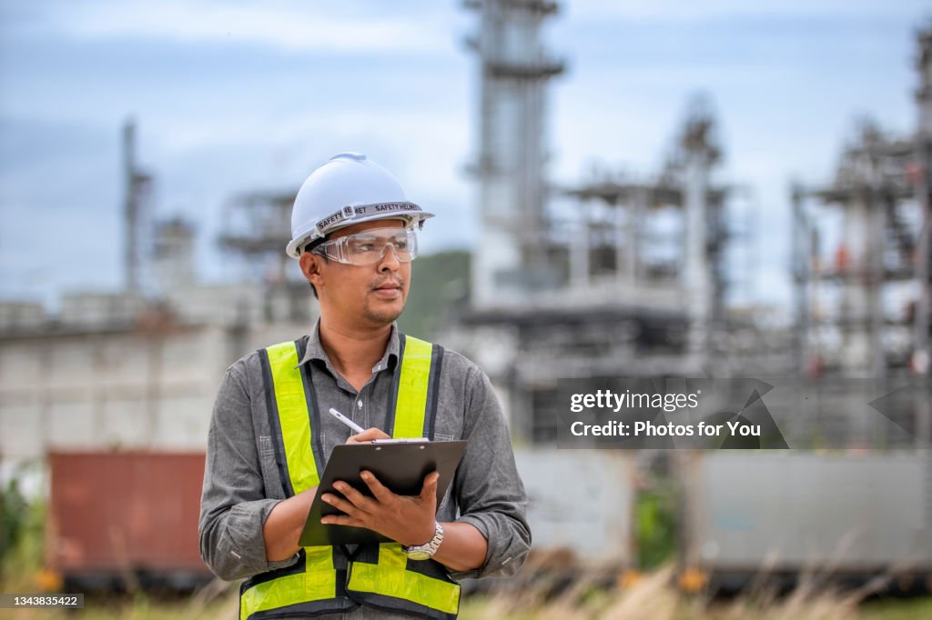 Refining Engineer Refinery Engineers Taking System Data After System Audit High-Res Stock ...