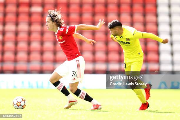 Alvaro Fernandez of Manchester United battles for possession with Antonio Pacheco Ruiz of Villarreal CF during the UEFA Youth League - Group F match...