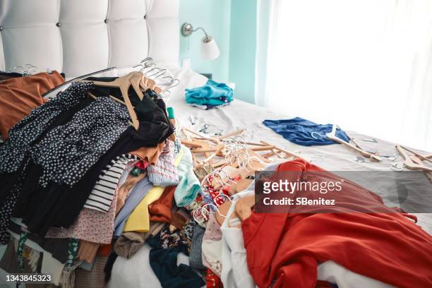closet cleaning, clothing selection - kleid stock-fotos und bilder