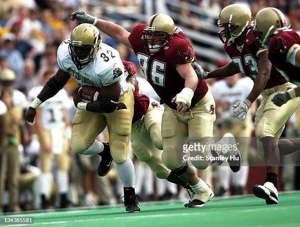 Fullback Lousaka Polite is pursued by David Kashetta of Boston College during Pittsburgh's 24-13 victory over BC at Alumni Stadium in Newton,...