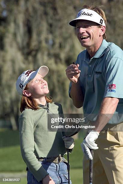 Mary Dawson responds to a question from golfer Brad Faxon, right, during a kids golf clinic at Bayhill Country Club in Orlando, Florida on Wednesday,...