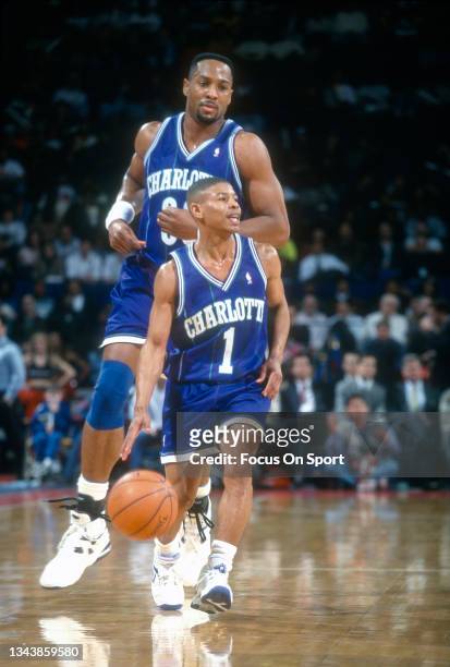 Muggsy Bogues of the Charlotte Hornets dribbles the ball against the Washington Bullets during an NBA basketball game circa 1995 at the US Airways...