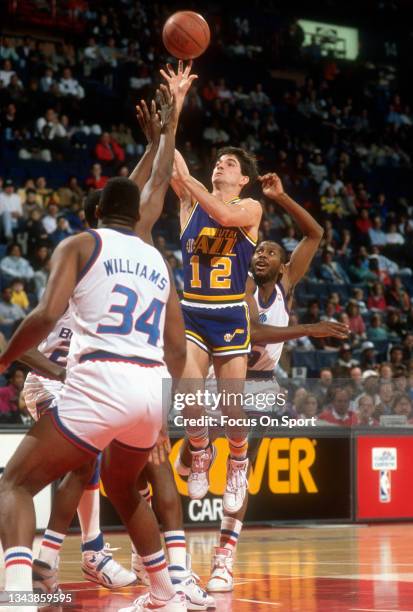 John Stockton of the Utah Jazz shoots against the Washington Bullets during an NBA basketball game circa 1989 at the Capital Centre in Landover,...