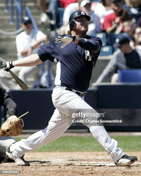 New York Yankees DH Jason Giambi drives the ball deep the Pittsburgh Pirates during a spring training game on March 18, 2007 at Legends Field in...