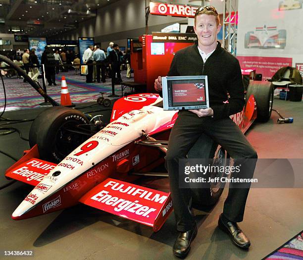 Indy car driver Scott Dixon, winner of the 2003 Indy Racing League Championship holds a Tablet PC at COMDEX in Las Vegas November 17, 2003. The...