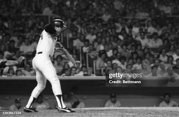 Reggie Jackson, the controversial $3 million slugger of the New York Yankees, fouls out while trying to bunt during the 10th inning during the game...