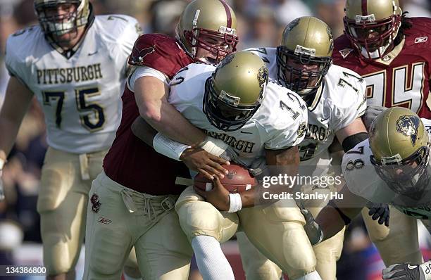 Quarterback Rod Rutherford of Pittsburgh gets tackled by Phillip Mettling of Boston College during Pittsburgh's 24-13 victory over BC at Alumni...