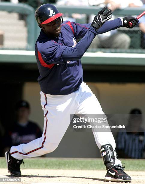 Atlanta Braves infielder Edgar Renteria connects for a hit in a spring training game against the Los Angeles Dodgers Wednesday March 15, 2006 at Wide...