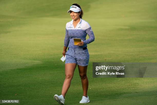 Jenny Shin of Korea smiles as she walks the 9th hole fairway during the first round of the Walmart NW Arkansas Championship at Pinnacle Country Club...