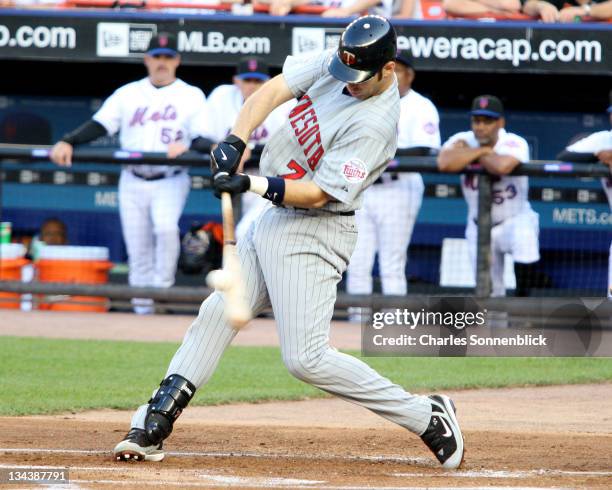Minnesota Twins catcher Joe Mauer connects for a base hit against the New York Mets on June 18, 2007 at Shea Stadium in Queens, New York.