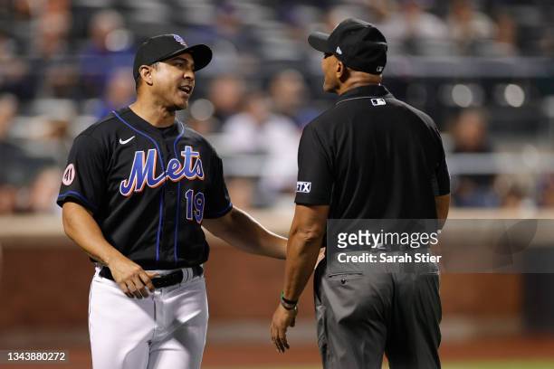 Manager Luis Rojas of the New York Mets talks with the umpire during the eighth inning against the Philadelphia Phillies at Citi Field on September...