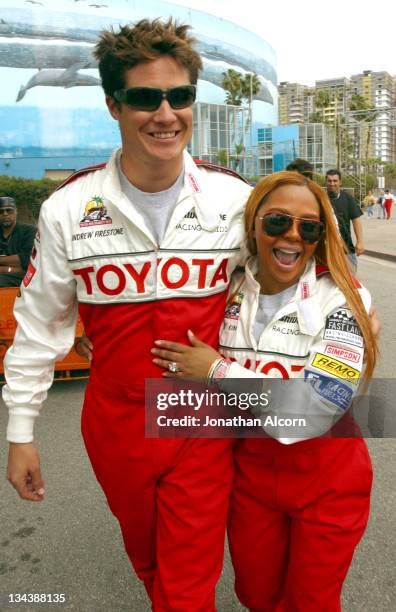 Andrew Firestone and Lil' Kim during 2004 Toyota Long Beach Grand Prix Pro/Celebrity Race - Press Day at L.B. Grand Prix Pit Lane in Long Beach,...