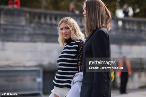 Lena Perminova and Kristina Romanova outside Dior on September 28, 2021 in Paris, France.