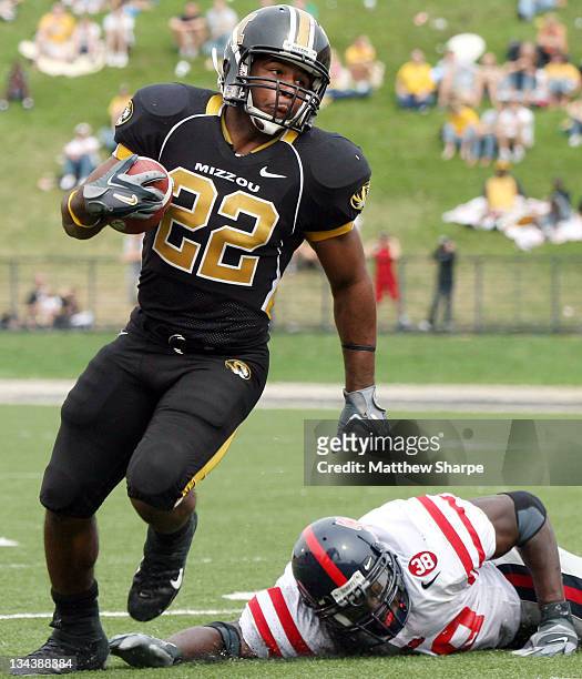 Missouri running back Tony Temple runs just out of Ole Miss linebacker Patrick Willis' reach during the game between the Mississippi Rebels and the...