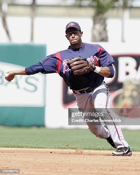 Atlanta Braves infielder Tony Pena fields a ground ball and throws to first for the out in a spring training game against the New York Yankees...