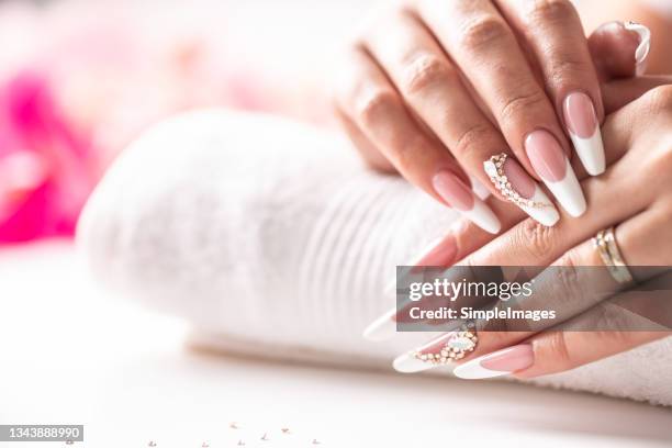 art gel nails made for the bride for her wedding moments. - gel pack stock pictures, royalty-free photos & images