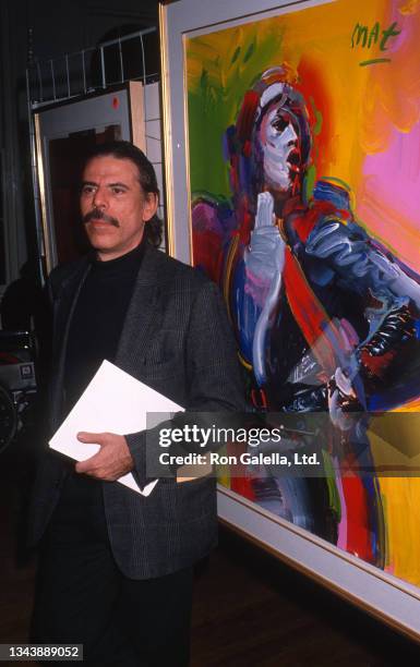 German-born American Pop artist Peter Max attends an Echo Lake Idea celebrity art auction at the Puck Building, New York, New York, November 15, 1989.