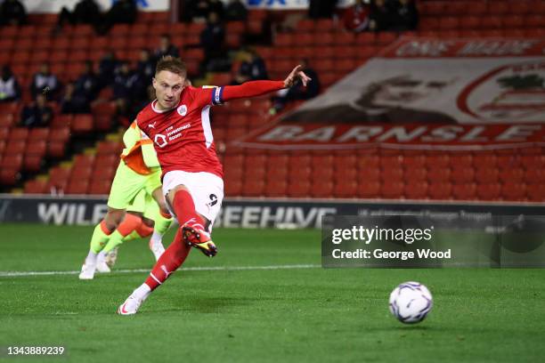 Cauley Woodrow of Barnsley scores their side's first goal from the penalty spot during the Sky Bet Championship match between Barnsley and Nottingham...