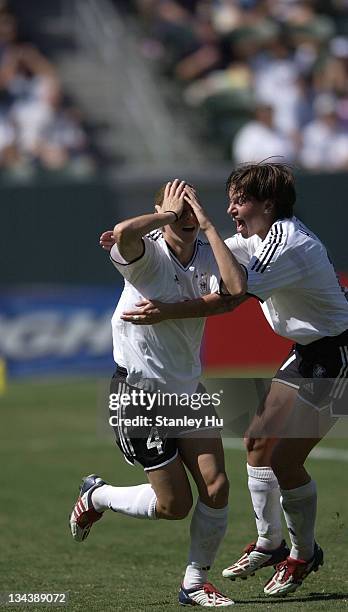 Germany's Nia Kuenzer reacts after scoring the winning goal in overtime play of the FIFA Women's World Cup Finals at the Home Depot Center in Carson,...